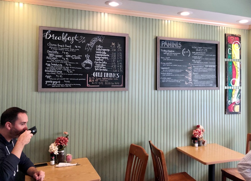 Artsy chalkboard menus featuring coffee and eats