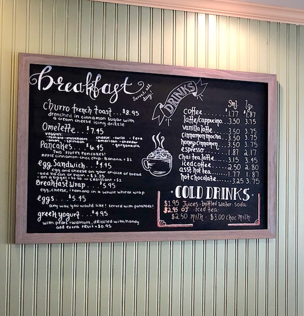 chalkboard menu with breakfast and coffee drinks